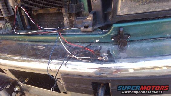 i needed a place to mount the plug for the controller. i soldered new wires to the plug and ran them to the solenoid pack. i decided it would be better to mount it to the body instead of the bumper incase i have to pull the bumper off to service the winch, it would be hard to get the connector off each time. also it has less chance of damage from stepping on it.

i mounted it on the driver side so it will give more slack to use the controller from inside the vehicle. and the cord wont have to go over the cable where it can cause issues