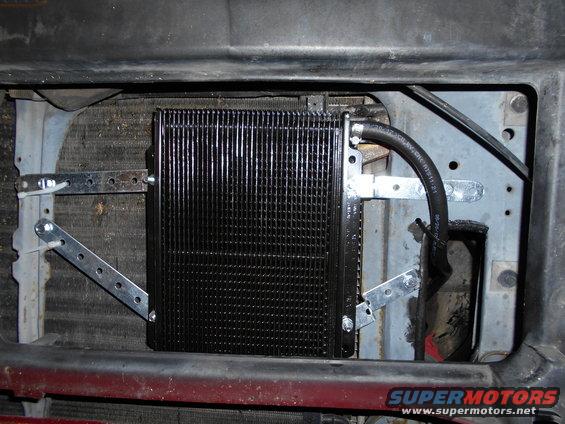 Mounted in front of AC condensor.