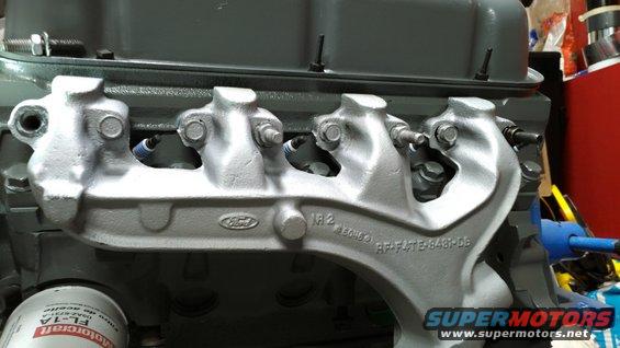 After sandblasting, planing, painting (Rustoleum High Heat Silver), & new flange hardware (cheapo aftermarket because there were no others at the time); I applied red silicone & installed the manifolds.  This one is significantly warped - the front port is noticeably higher on the head than the other 3, which necessitated torching its top to make it bend down so I could install the last bolt (388469-S).

None of the bolts have been torqued in this pic; they're all very loose, except the center one in the small hole is barely snug.

[url=https://www.supermotors.net/registry/media/1055473][img]https://www.supermotors.net/getfile/1055473/thumbnail/exhmanbolt.jpg[/img][/url]