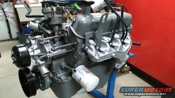 20181211_110046.jpg Eventually, I got all the exhaust manifold bolts in (with nickel anti-seize) & torqued.  Then I added the heat shields & accessory nuts.

[url=https://www.supermotors.net/registry/media/1055473][img]https://www.supermotors.net/getfile/1055473/thumbnail/exhmanbolt.jpg[/img][/url] . [url=https://www.supermotors.net/registry/media/1055205][img]https://www.supermotors.net/getfile/1055205/thumbnail/05gray54.jpg[/img][/url]

The oil pressure port is extended using common plumbing parts (I may swap to a factory extension or [url=https://www.amazon.com/dp/B07H6ZSMG2]this stainless reproduction[/url]) in preparation for an older sender ([url=https://www.amazon.com/dp/B000C7ZT3E]Standard PS60[/url]) so the gauge will actually work.

The distributor body was sandblasted & clearcoated, but I need to clean the cap & probably replace the wires.  The MAF body was also blasted & cleared (NOT the sensor).

The oil fill cap is a new [url=https://www.amazon.com/dp/B000C5HJP2]MotorCraft EC-743[/url] (F3AZ-6766-B).

The harmonic balancer was also sandblasted & painted.  Then its sealing surface was wire-wheeled clean again, and lubed before installation.  Its pulley is new, like the WP, TC, t'stat cover, & spark plugs.  But the oil pan gasket & valve cover gaskets are the original (reusable) '96 parts.