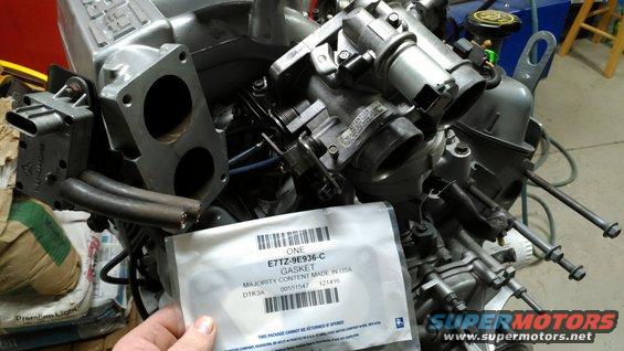 After mounting the plenum, the throttle body (carefully sandblasted & clearcoated) went on with a new gasket.