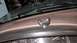 1995 Ford Bronco - A chrome knob is mounted on the dashboard of a vehicle, with gauges visible underneath.