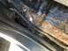 1992 Ford Bronco - Significant rust damage is visible on the rocker panel, indicating extensive corrosion.
