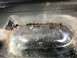 1992 Ford Bronco - Close-up of a heavily rusted vehicle floor pan, showing significant corrosion and damage.
