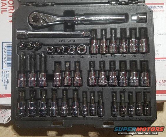 Socket wrench and assorted bits in a black case. Some bits have sizes like 5/32, 7/32, 1/4, 5/16, 3/8