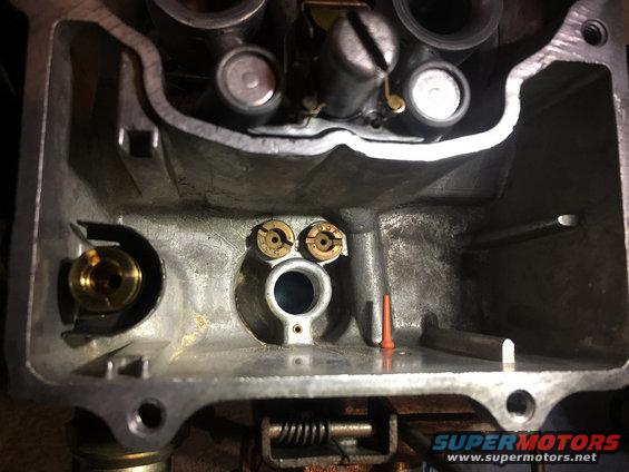 Carburetor interior with two brass jets visible
