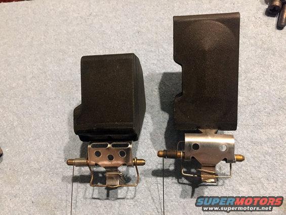 two carburetor parts side-by-side on a gray surface
