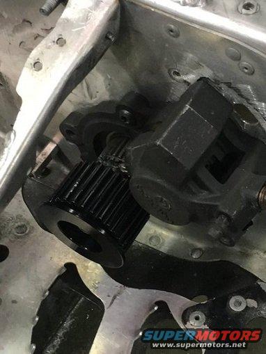 Close-up of snowmobile drive pulley and brake caliper assembly