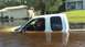 2006 Honda RANCHER - Pickup truck submerged in floodwaters from Irma flooding, with houses in the background.