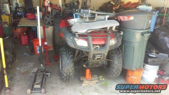 2006 Honda RANCHER front view, raised on hydraulic jack in garage