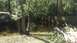 2006 Honda RANCHER - Backyard flooded after heavy rains, with water reaching the wooden fence line.