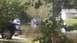 2006 Honda RANCHER - Several vehicles are partially submerged in floodwaters on a residential street.
