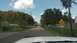 2006 Honda RANCHER - A view down a residential street with a single car ahead and a dead end sign.