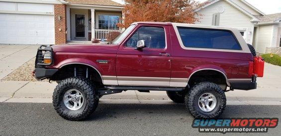 1996 Ford Bronco with lifted suspension, off-road tires, and aftermarket bumpers