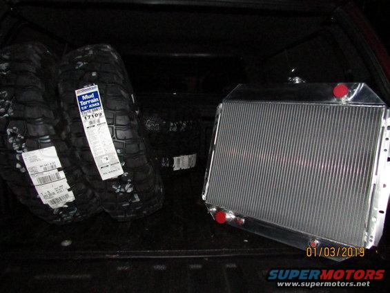BFGoodrich Mud Terrain tires and an aluminum radiator in a vehicle bed