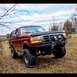 1995 Ford Bronco - This 1995 Ford Bronco is equipped with a winch and heavy-duty bumper, ready for off-road adventures.