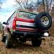 1995 Ford Bronco - Rear view of a 1995 Ford Bronco showing its spare tire and aftermarket bumper.