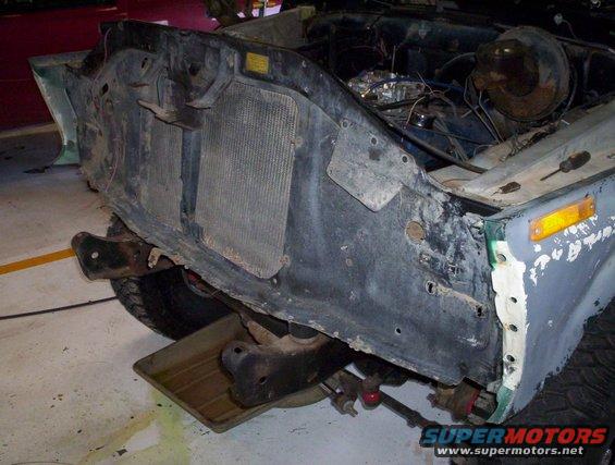 1978 Ford Bronco front end with radiator removed, showing engine bay and fender