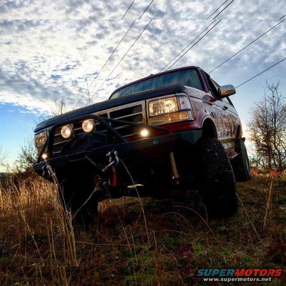 Red 1995 Ford Bronco with winch and off-road bumper