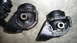 1993 Mazda MX-3 - Close-up of two engine mounts, possibly for a Mazda, showing their construction.