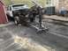 1992 Ford Bronco - This 1992 Ford Bronco is undergoing a tear-down, with its engine being hoisted out of the vehicle.