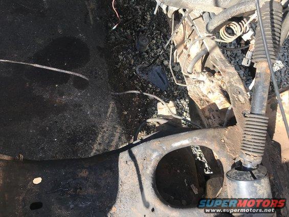 Engine bay and suspension parts, rusty frame