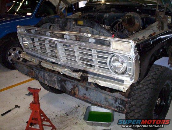 1978 Ford Bronco front end with damaged bumper and open hood