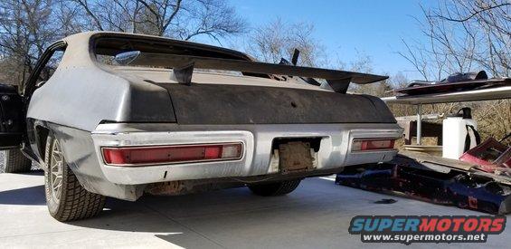 Rear view of a 1970 Pontiac Firebird with a large spoiler and chrome bumper