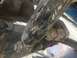 1989 Ford Bronco - A damaged shock absorber, likely from an older vehicle, shows significant wear and tear.