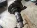 1989 Ford Bronco - Close-up of a heavily rusted wheel hub assembly, showing wear on the splined shaft and bearing.