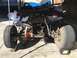 1970 Volkswagen Beetle - Custom vehicle chassis with exposed engine and rear wheels, supported by jacks.