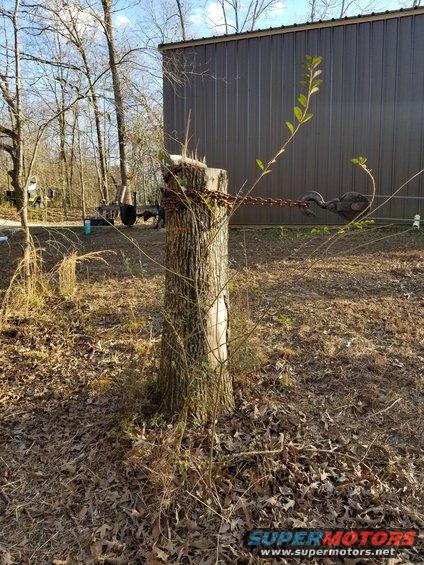 Even though the winch is at full-stall, it doesn't even look like there's any tension on it.  It's not leaning, and the ground behind it isn't lifting at all.