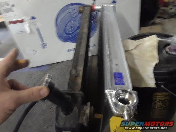 Radiator and engine component with Supermotors logo visible