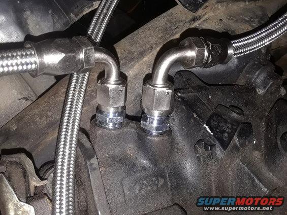 Braided hoses connected to engine component