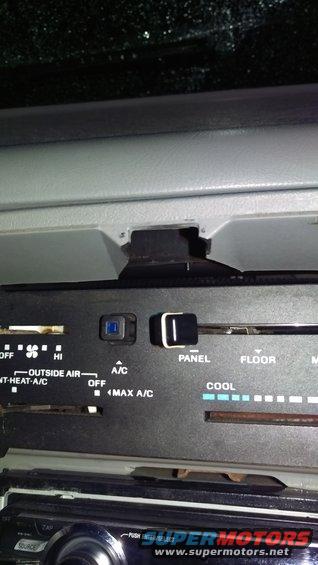 Interior dashboard climate controls with labels for A/C, panel, and floor