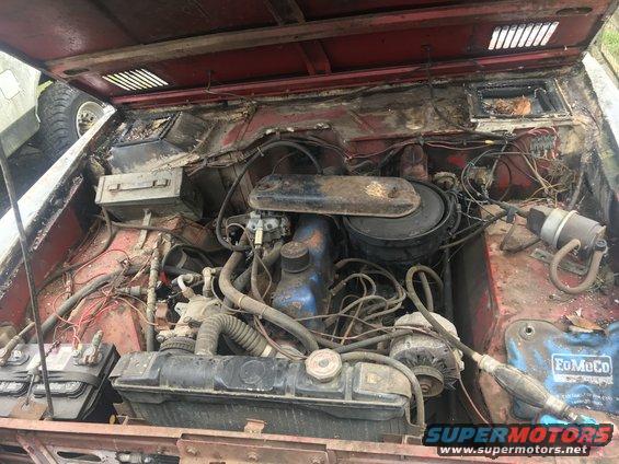 1967 Ford Bronco engine bay with FoMoCo battery