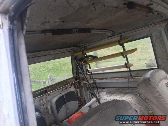 Interior view of vehicle with surfboards on ceiling rack