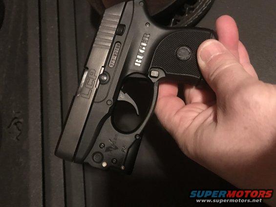 Ruger LCP pistol held in hand. Serial number 373-02189 visible