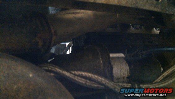 vehicle starter motor and exhaust pipe detail
