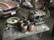 1970 Volkswagen Beetle - Disassembled Volkswagen Beetle engine parts are laid out next to a Jaguar XJ in a workshop.