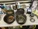 1991 Ford Bronco - Disassembled air cleaner components and a new filter are laid out on a workbench next to cleaning supplies.