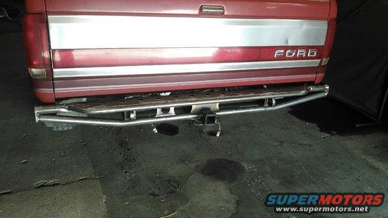 Red 1991 Ford F-150 rear with custom bumper and hitch