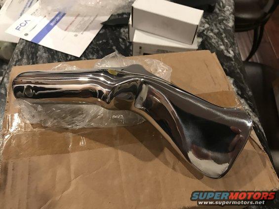 Chrome bumper part on cardboard