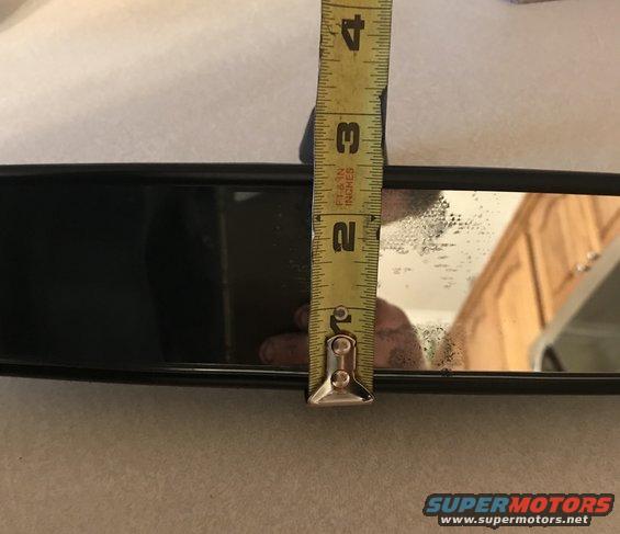 Rear-view mirror with a yellow measuring tape showing 2.5 inches