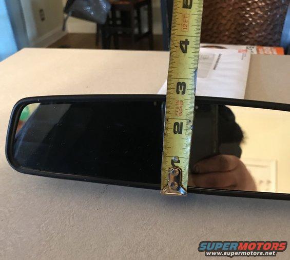 Rear-view mirror being measured with a tape measure; tape shows 3.5 inches