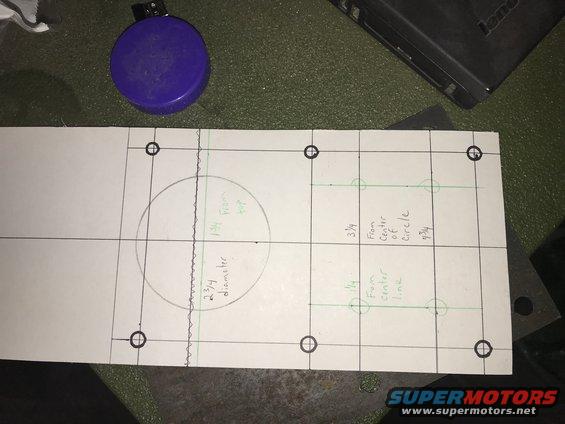 Paper with grid lines, a circle, and measurements drawn on it. Includes text like '2 3/4 diameter' and '1 3/4 from top'