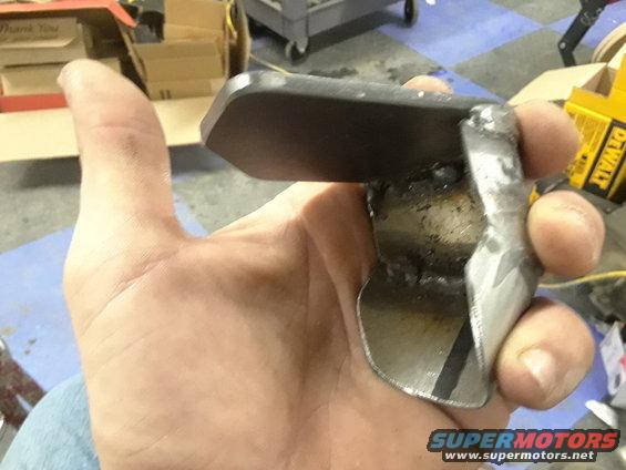 Metal bracket held in hand