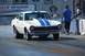 1970 Ford Maverick - A 1970 Ford Maverick with blue racing stripes is on the drag strip, ready for a race.