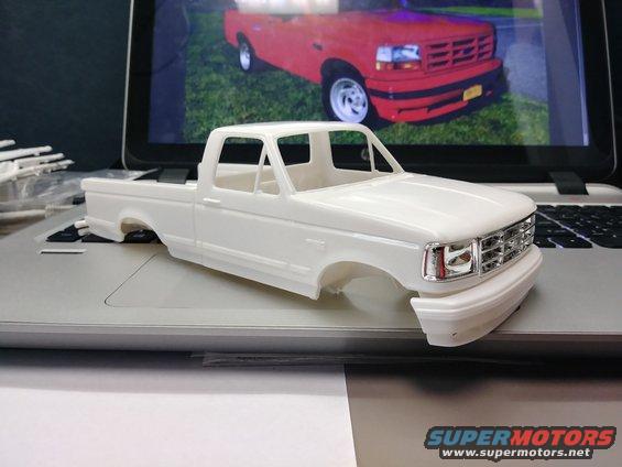 Initial mockup showing the fitment of the parts and some of the discrepencies of the model that don't belong in relation to the 1:1 truck. Three glaringly obvious issues is the chromed grille, the body side trim molding, and the wheel arch trim. Those will have to be removed to be accurate. Even though the real SVT Lightning was based off a XLT trim level, it never came with the XLT molding.
