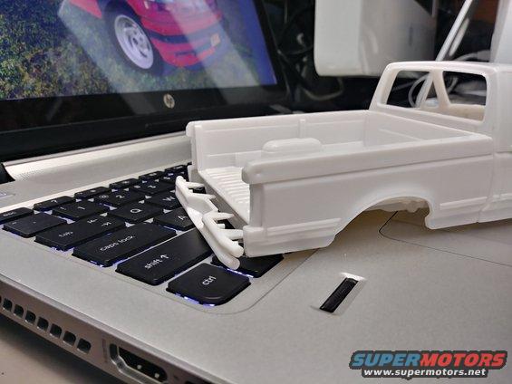 Initial mockup showing the fitment of the rear parts. It looks like along with the trim removal, some body work needs to be done to fix that plastic shrinkage above the tail light. That tube bumper looks awesome, too!
